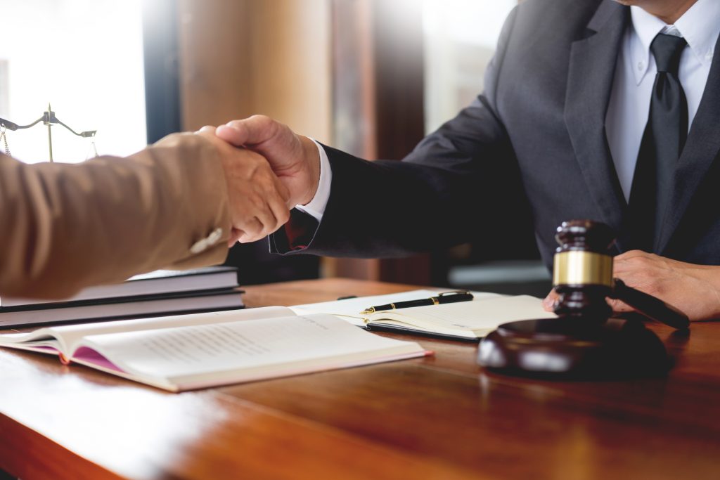 A handshake over a desk